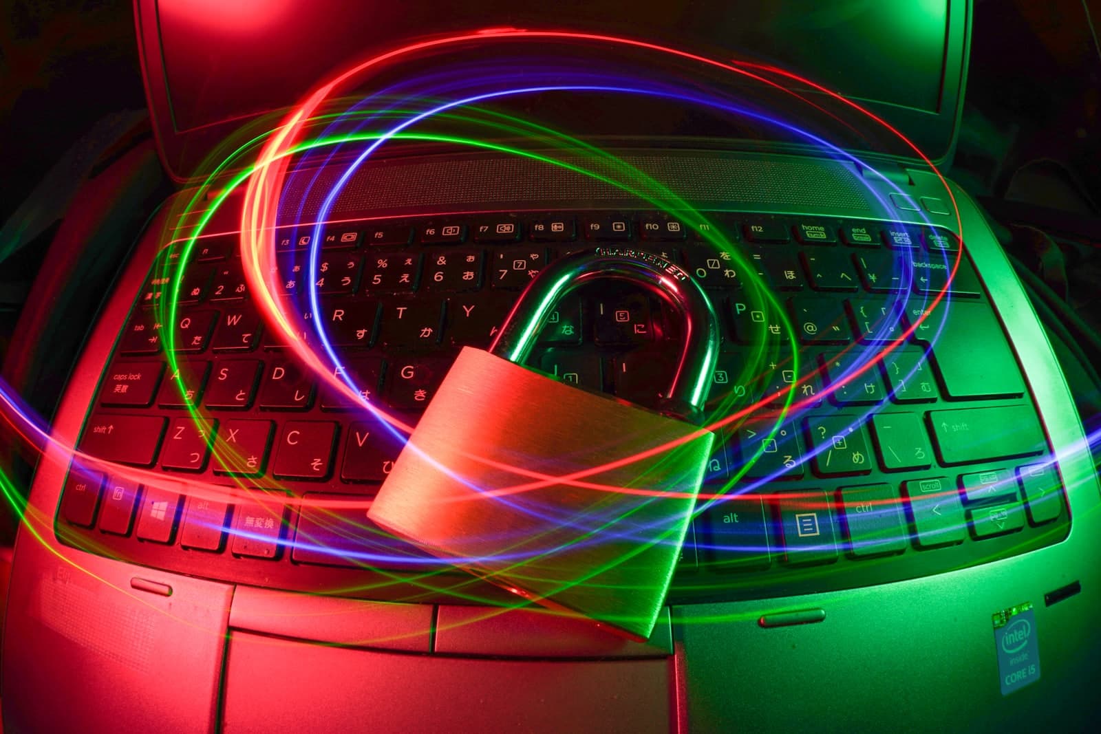 Padlock on laptop with light trails